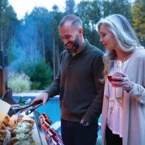 PRO825RSBIPSS-3-Web-Gallery-05-Prestige-Pro825-3-Life-Man-and-Woman-Grilling-Dusk