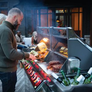PRO825RSBIPSS-3-Web-Gallery-06-Prestige-Pro825-3-Life-Man-and-Woman-Grilling-Dusk-On-Deck