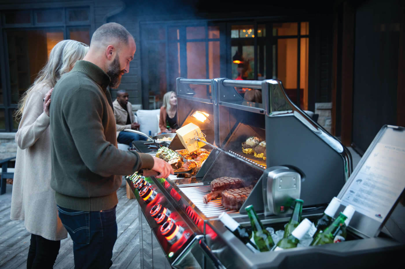 PRO825RSBIPSS-3-Web-Gallery-06-Prestige-Pro825-3-Life-Man-and-Woman-Grilling-Dusk-On-Deck