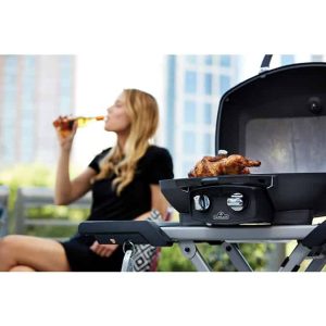 Travel-Q-PRO285X-lifestyle-girl-drinking-behind-grill-with-food