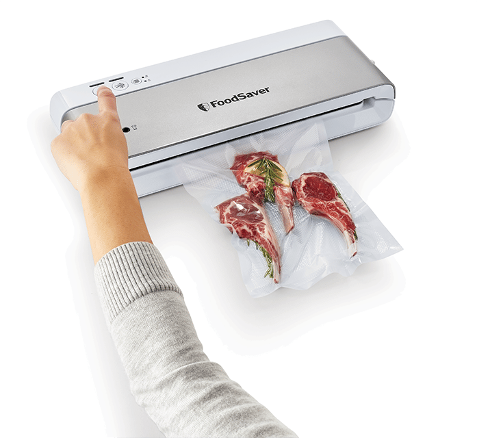 VS0100-foodsaver-white-ss-vacuum-with-talent-overhead-1