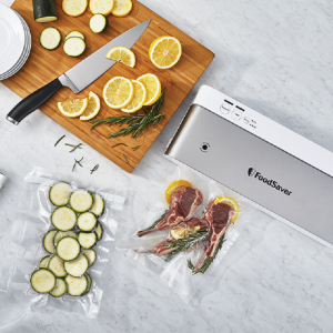 VS1500-foodsaver-white-ss-with-food-group-overhead-in-use-lifestyle-2